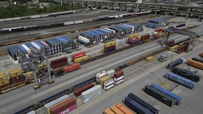 Shipping containers are loaded onto trucks at CSX Queensgate Rail Yard, May 7, 2025, Cincinnati.