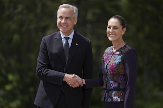 Canada's Prime Minister Mark Carney welcomes Mexican President Claudia Sheinbaum to the G7 Summit in Kananaskis, Alberta, June 17, 2025.