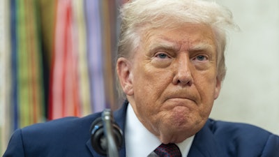 President Donald Trump pauses while speaking during an announcement about Apple with Apple CEO Tim Cook in the Oval Office, Wednesday, Aug. 6, 2025, in Washington.