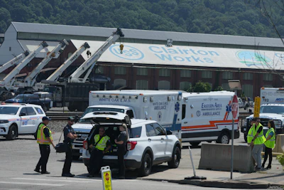 Emergency crew gather after an explosion at the Clairton Coke Works, a U.S. Steel coking plant, Monday, Aug 11, 2025, in Clairton, Penn.