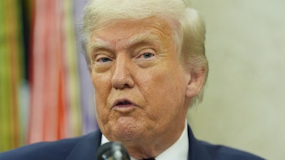 President Donald Trump makes an announcement about Apple in the Oval Office, Wednesday, Aug. 6, 2025, in Washington.