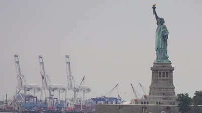 The Statue of Liberty is seen near Port Liberty Terminals, New York, Aug. 6, 2025.