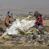 Workers recover debris at the scene of an Ethiopian Airlines Boeing Max plane crash on March 11, 2019, outside of Addis Ababa, Ethiopia.