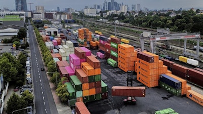 Containers are piled upon a cargo terminal in Frankfurt, Germany, Tuesday, Sept. 9, 2025.