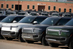A long line of unsold 2024 R1S electric utility vehicles sits at a Rivian service center Nov. 26, 2024, in east Denver.