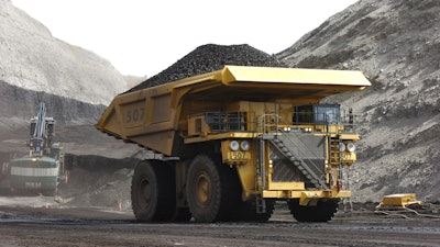 In this April 4, 2013, file photo, a mining dumper truck hauls coal at Cloud Peak Energy's Spring Creek strip mine near Decker, Mont.