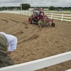 MK Bashar, right, test drives an electric tractor as Ben Phillips, left, watches Tuesday, Aug. 19, 2025, during a demonstration in East Lansing, Mich.