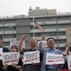 Protesters stage a rally against the detention of South Korean workers during an immigration raid in Georgia, near the U.S. Embassy in Seoul, South Korea, Tuesday, Sept. 9, 2025. The signs read 'A tariff bomb and workers confinement.'