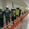 This image from video provided by U.S. Immigration and Customs Enforcement via DVIDS shows manufacturing plant employees being escorted outside the Hyundai Motor Group’s electric vehicle plant, Thursday, Sept. 4, 2025, in Ellabell, Ga.