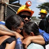 A miner embraces his relatives after he was rescued from a gold mine that had collapsed in Segovia, Colombia, Wednesday, Sept. 24, 2025.