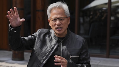 CEO of Nvidia Jensen Huang speaks during a press conference at the Mandarin Oriental Qianmen after attending the third China International Supply Chain Expo, in Beijing, July 16, 2025.