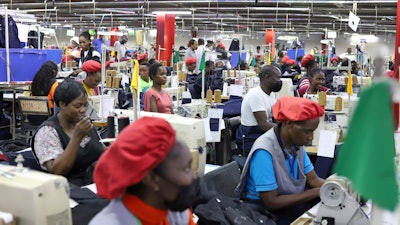 Factory workers operate machines to make garments at United Aryan EPZ Limited in Ruaraka on the outskirts of Nairobi, Kenya, March 21, 2025.