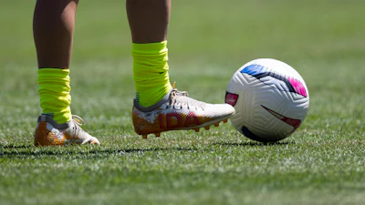 Washington Spirit midfielder Courtney Brown warms up with cleats that read 'IDA' before a NWSL soccer match against Bay FC on Saturday, Aug. 23, 2025, in San Francisco.