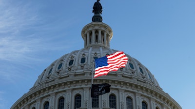 The American flag over the Capitol in Washington, Oct. 1, 2025.