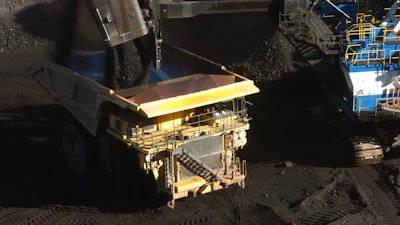 A mechanized shovel loads coal into a haul truck at the Spring Creek mine, in this Nov. 15, 2016 photo, near Decker, Mont.