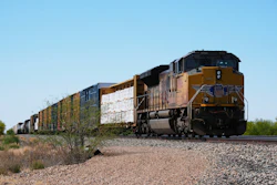 A Union Pacific freight train idles on the track as it waits to continue moving, Thursday, April 17, 2025, in Red Rock, Ariz.