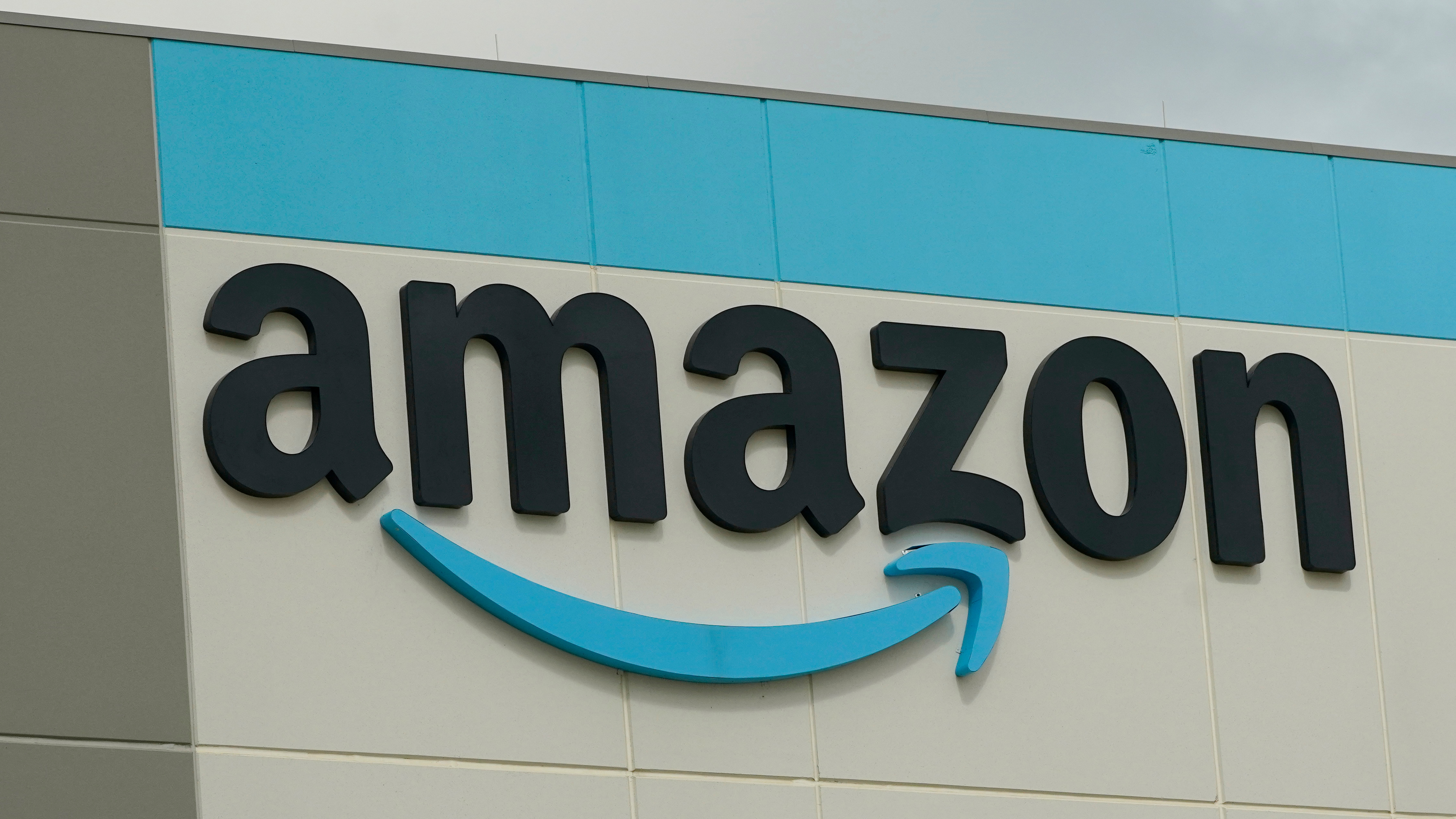 The Amazon logo is pictured at the Amazon Robotic Sorting Fulfillment Center in Madison County, Miss., Aug. 11, 2022.