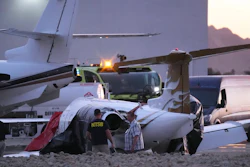 Investigators look at a crashed Learjet at Scottsdale Airport after it collided with a parked plane Feb. 10, 2025, in Scottsdale, Ariz.