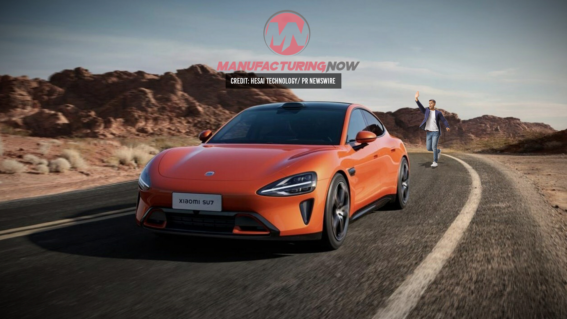 Orange Xiaomi electric sports car on a winding mountain road with rocky landscape