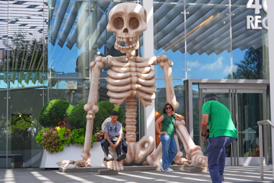 Sam Desai, right, takes a Halloween-themed photo of his wife, Sonia Desai, and son, Rishan Desai, in downtown Dallas, Sept. 27, 2025.