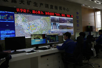 A control center monitor autonomous mining truck operations in the Huaneng Yimin open-pit coal mine in Hulunbuir in northern China's Inner Mongolia province China, Monday, Sept. 15, 2025.