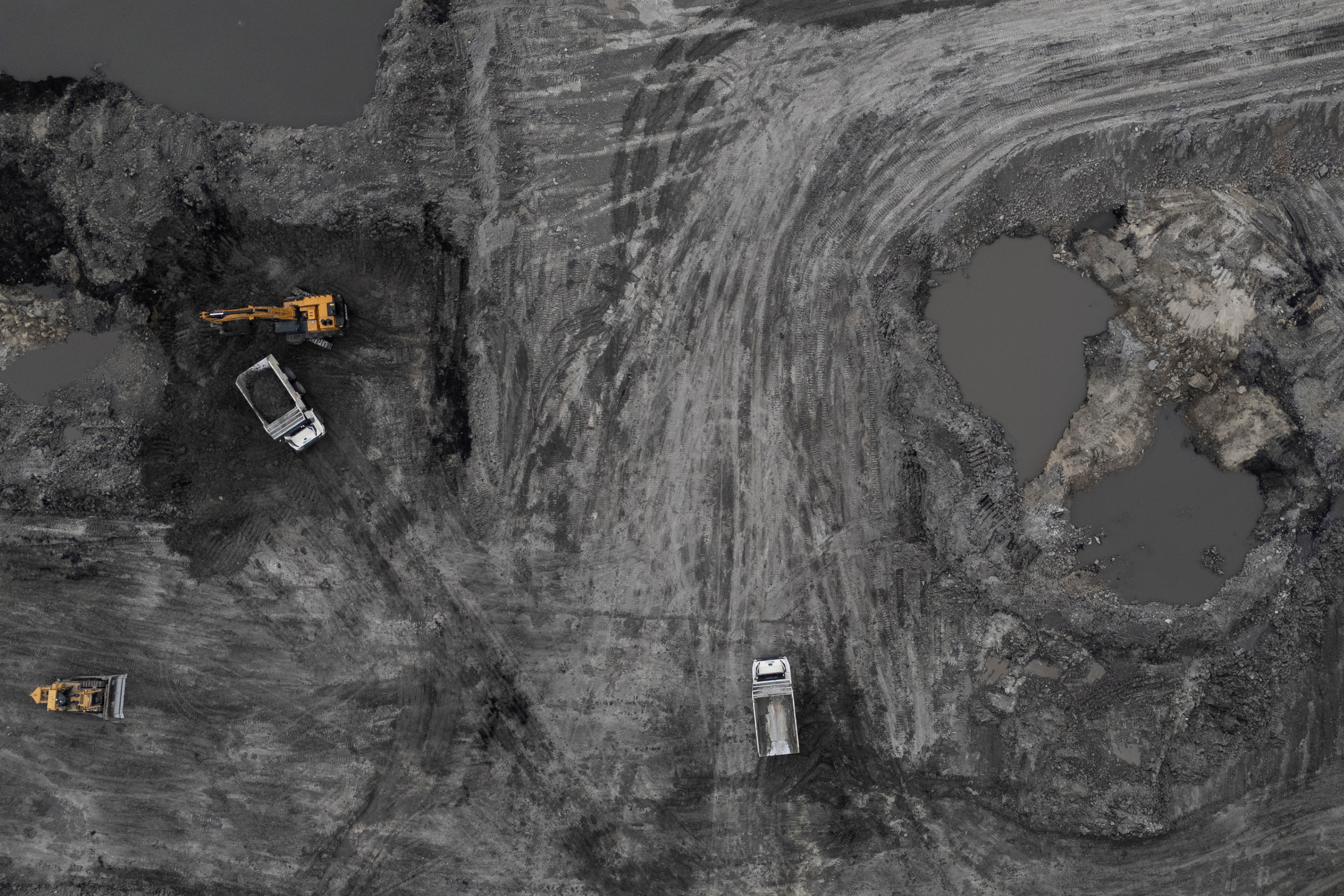 Autonomous mining trucks operate in the Huaneng Yimin open-pit coal mine in Hulunbuir in northern China's Inner Mongolia province China, Monday, Sept. 15, 2025.