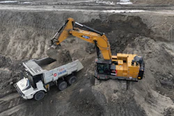 An excavator loads an autonomous mining truck in the Huaneng Yimin open-pit coal mine in Hulunbuir in northern China's Inner Mongolia province China, Monday, Sept. 15, 2025.