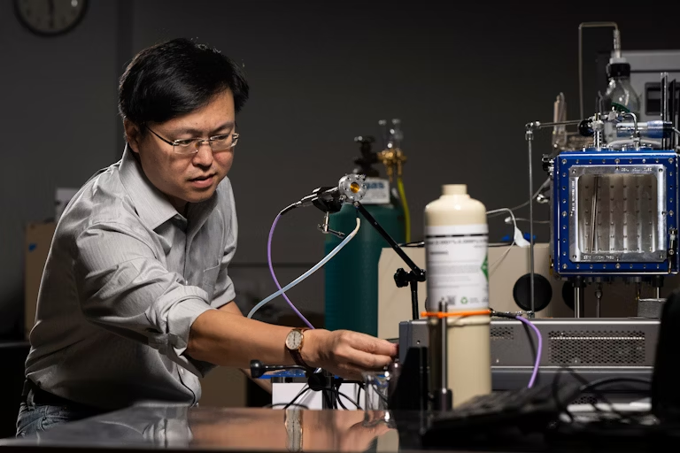 Scientist working with laboratory equipment and scientific instrumentation