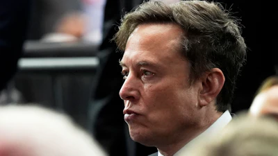 Elon Musk attends a memorial for conservative activist Charlie Kirk, Sunday, Sept. 21, 2025, at State Farm Stadium in Glendale, Ariz.