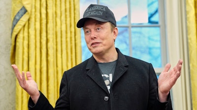 Elon Musk speaks during an event with President Donald Trump in the Oval Office at the White House, Feb. 11, 2025, in Washington.
