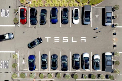 Tesla vehicles line a parking area at the company's Fremont, Calif., factory, Aug. 5, 2025.