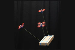 Three drones carry a load together, using the new algorithm developed at TU Delft, The Netherlands.