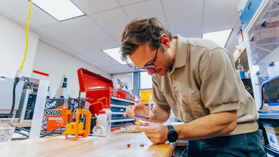 OSU researcher Devin Roach in the lab