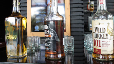 In this Aug. 22, 2014, file photo, Wild Turkey sampling bottles sit on the bar at the distillery's visitors' center near Lawrenceburg, Ky.