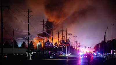 Plumes of smoke rise from the area of a UPS cargo plane crash at Louisville Muhammad Ali International Airport, Louisville, Ky., Nov. 4, 2025.