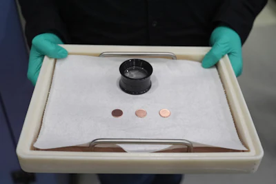 Blank coins wait to be the last pennies pressed at the U.S. Mint in Philadelphia, Wednesday, Nov. 12, 2025.
