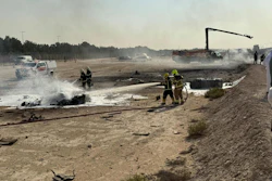 Emergency services attend the scene after an Indian HAL Tejas crashed during a demonstration at the Dubai Air Show, at Al Maktoum International Airport at Dubai World Central, Dubai, United Arab Emirates, Friday Nov. 21, 2025.