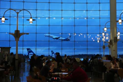 An Alaska Airlines airplane is seen from the central terminal as it takes off at Seattle-Tacoma International Airport Sunday, Nov. 23, 2025, in SeaTac, Wash.