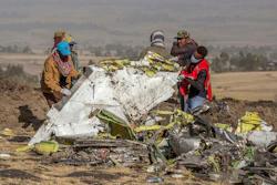 In this March 11, 2019, file photo, rescuers work at the scene of an Ethiopian Airlines flight crash near Bishoftu, Ethiopia. Pilot Bernd Kai von Hoesslin pleaded with his bosses for more training on the Boeing Max, just weeks before the Ethiopian Airline's jet crashed, killing everyone on board.