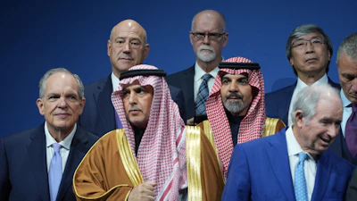 Saudi Investment Forum participants stand together before they are photographed as a group with President Donald Trump and Saudi Arabia's Crown Prince Mohammed bin Salman at the Kennedy Center, Wednesday, Nov. 19, 2025, in Washington.