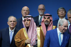 Saudi Investment Forum participants stand together before they are photographed as a group with President Donald Trump and Saudi Arabia's Crown Prince Mohammed bin Salman at the Kennedy Center, Wednesday, Nov. 19, 2025, in Washington.