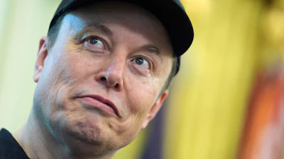 Elon Musk listens as President Donald Trump speaks during a news conference in the Oval Office of the White House, May 30, 2025, in Washington.
