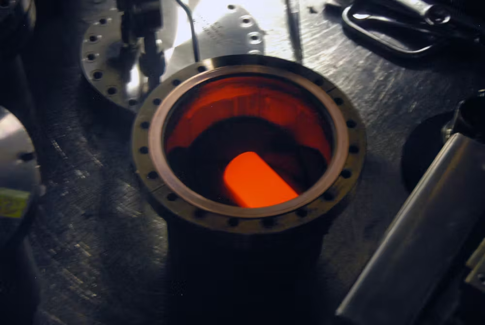 The nuclear heat source for the Mars Curiosity rover, part of a radioisotope thermoelectric generator, is encased in a graphite shell. The fuel glows red hot because of the radioactive decay of plutonium-238.