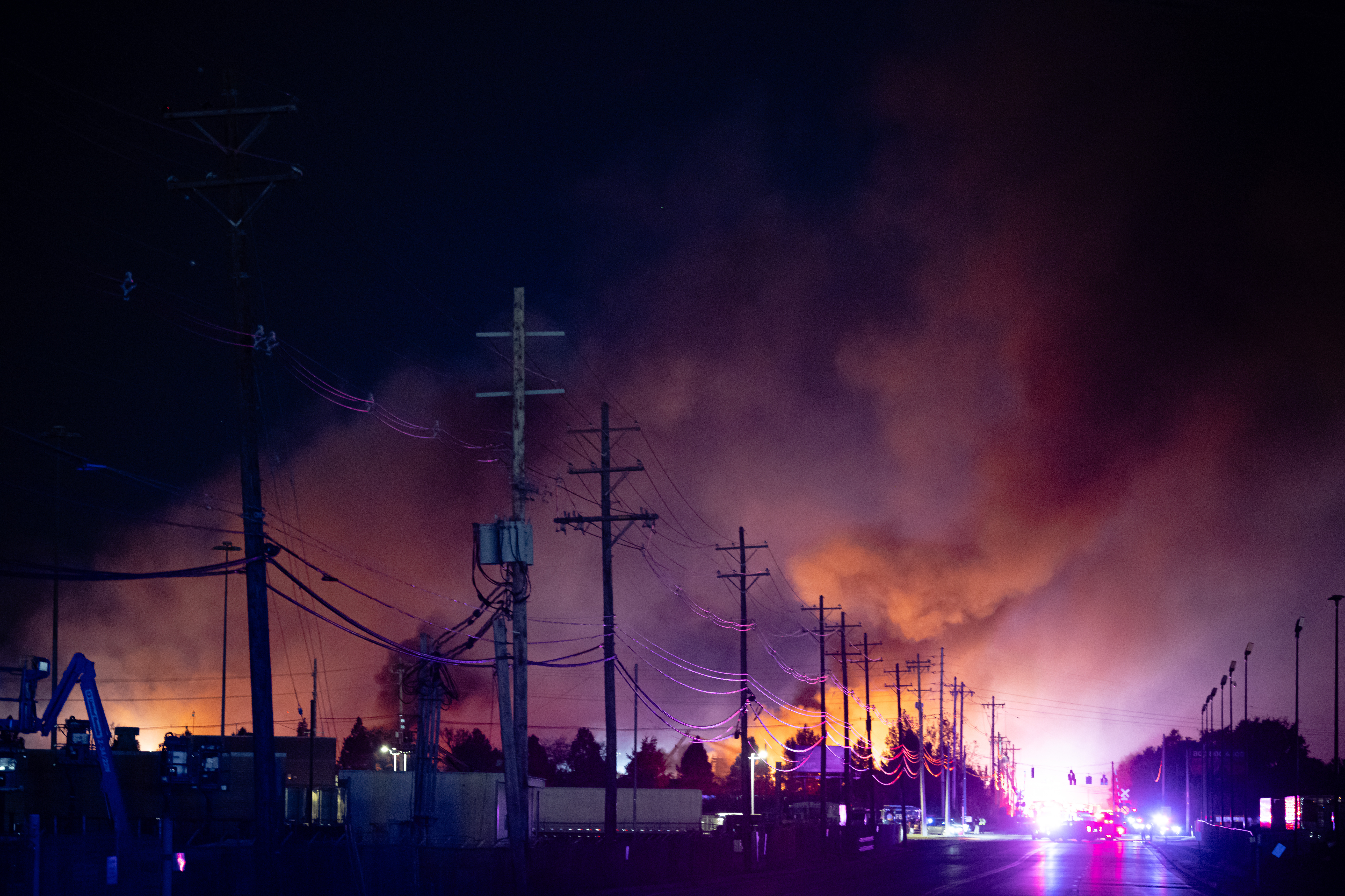 A plume of smoke rises from the site of a UPS cargo plane crash at Louisville Muhammad Ali International Airport on Tuesday, Nov. 4, 2025, in Louisville, Ky.