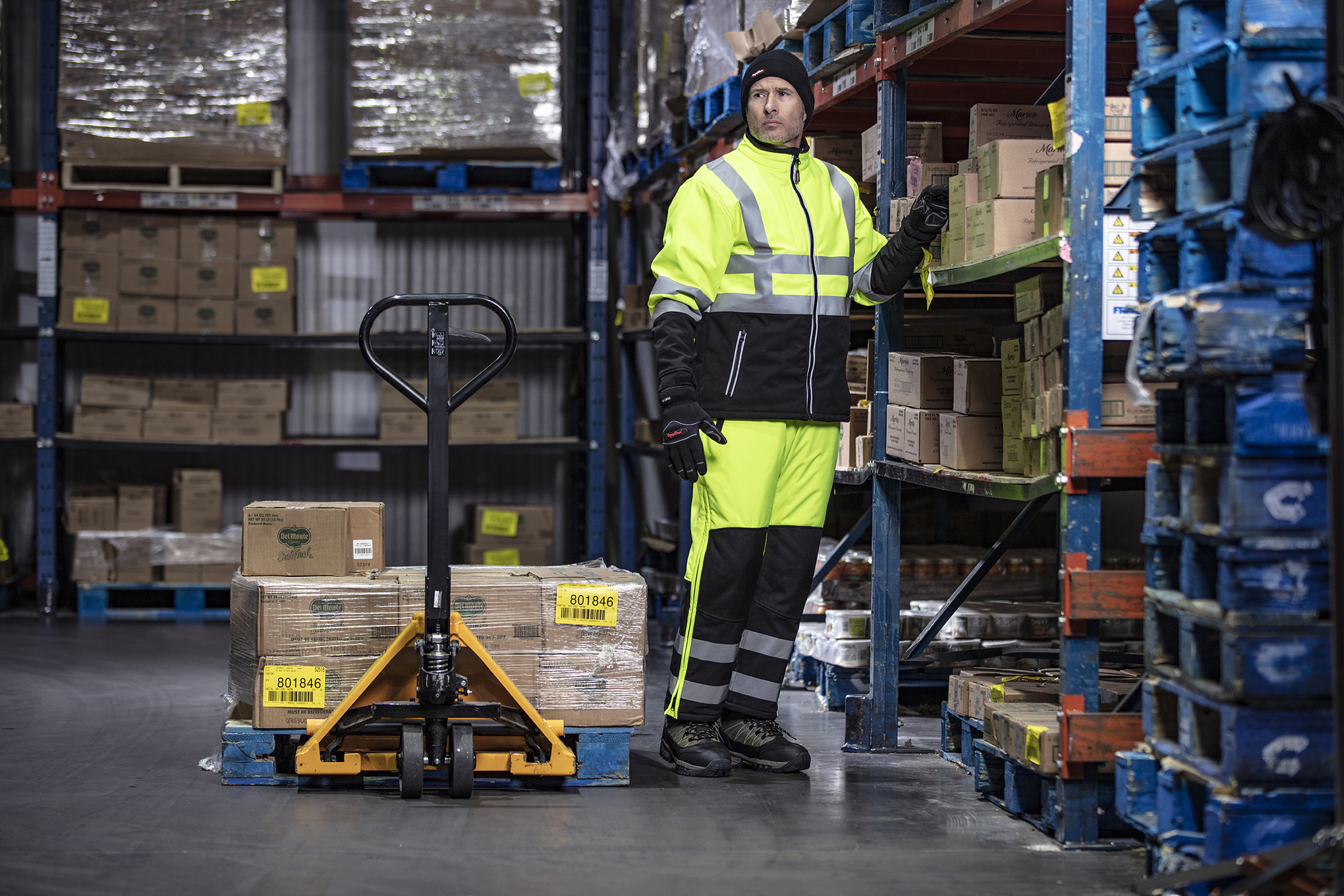 An order selector stays warm, comfortable and safe while working in a subzero freezer warehouse.