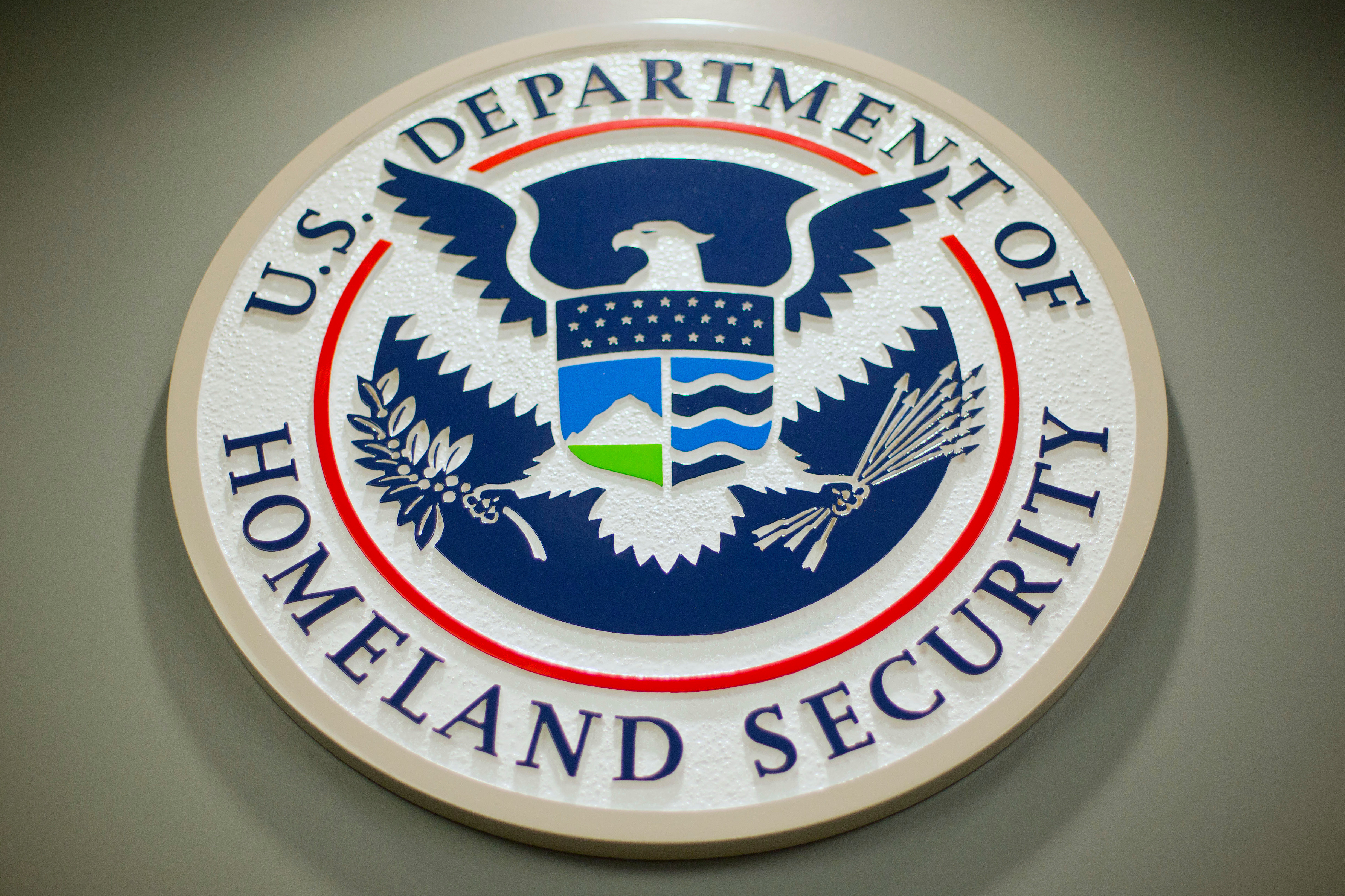The Department of Homeland Security logo is seen during a news conference in Washington, Feb. 25, 2015.