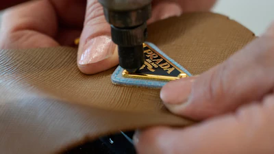 A leather good operator works at the Prada factory in Scandicci, Italy, Friday, Nov. 28, 2025.