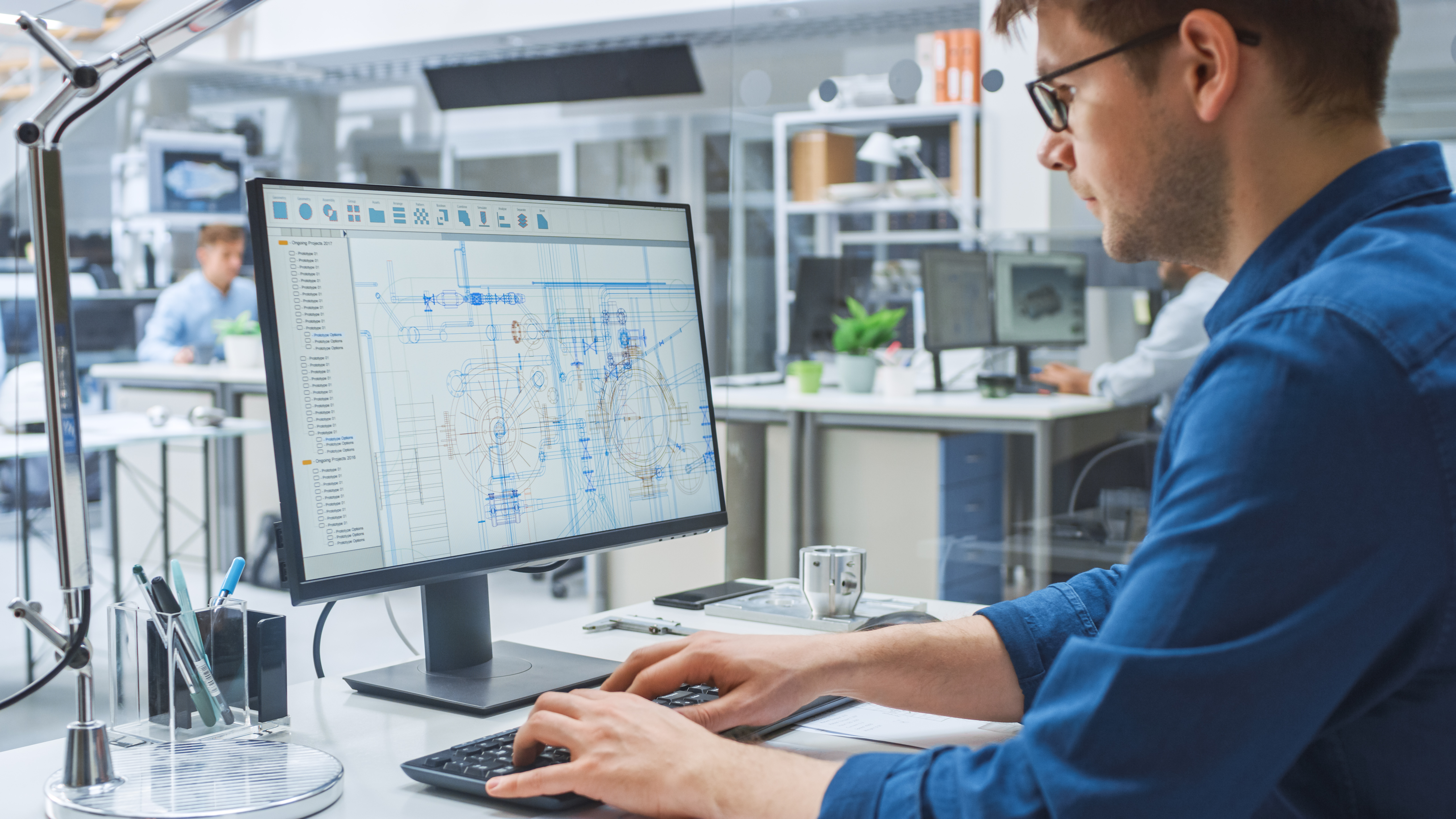 Engineer working with CAD software.