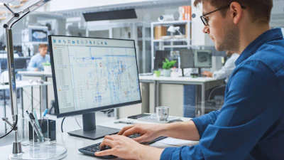 Engineer working with CAD software.
