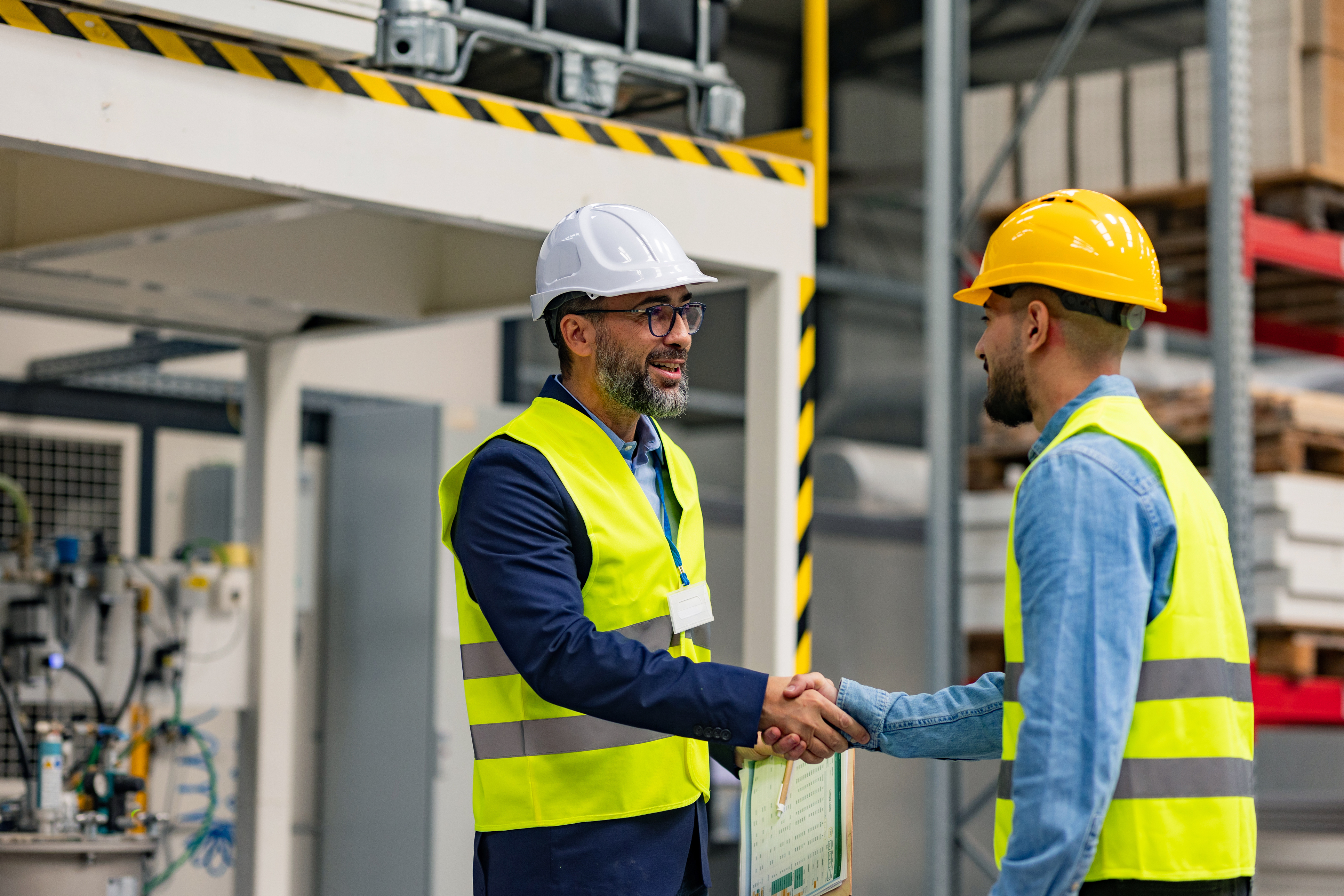Engineer shaking hands with project manager.